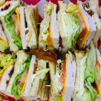 Traditional Turkey Club · All natural, in house roasted turkey, cheddar cheese, applewood smoked bacon, lettuce, tomat...