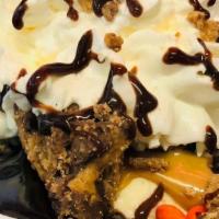 Peanut Butter Sundae · Vanilla ice cream, rich hot fudge, reese's peanut butter sauce, cups and pieces, whipped cre...