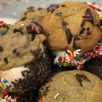 Ice Cream Sandwich · Homemade chocolate chip cookies filled with chocolate and vanilla ice cream and rolled in sp...