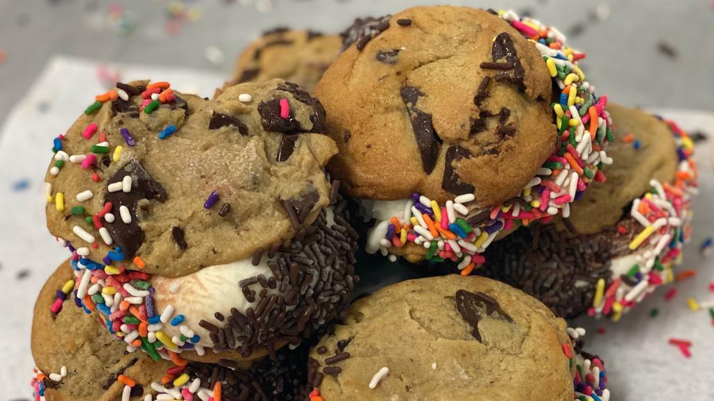 Ice Cream Sandwich · Homemade chocolate chip cookies filled with chocolate and vanilla ice cream and rolled in sprinkles and jimmies!