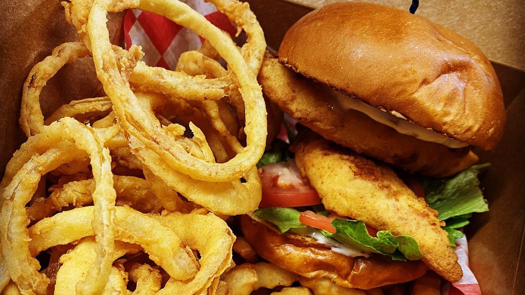 Fish Sandwich  · Fresh Haddock breaded and fried to order on a grilled brioche bun with lettuce, tomato and homemade tartar sauce. Fries, onion rings and homemade slaw on the side.