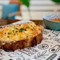 Cheese Toast · Sharp cheddar & Romano cheese, paprika, chives