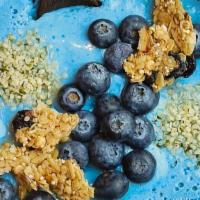 Kai Bowl · A mixture of Pineapple, banana, oat milk and blue spirulina topped with blueberries, house-m...