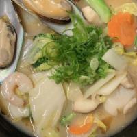Seafood Ramen · Shrimp, squid, mussels, snow bean, mushrooms, carrots, scallions, seaweed.