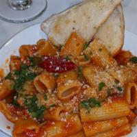 Rigatoni Fra’ Diavolo Shrimp & Pancetta · calabrian chili tomato sauce, shrimp and herbs, olive oil, parmesan cheese, pancetta, served...