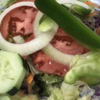 Garden Salad · Mixed greens, sliced tomatoes, peppers, onions, cucumbers, kalamata olives and hard-boiled e...