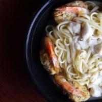 Shrimp Scampi · Jumbo Shrimp in Garlic & Lemon Sauce, Served over Linguini.