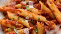 Penne Arrabiata · Penne with Sliced Fresh Garlic, Crushed Red Peppers, Parmigiana Cheese and Marinara Sauce.