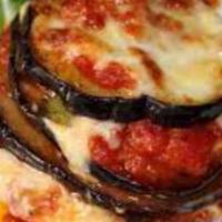 Eggplant Parmigiana · Fried Eggplant with Tomato Sauce and Mozzarella Cheese on Top.