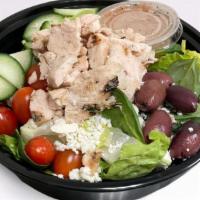 Greek Salad · mixed greens salad topped with kalamata olives, crumbled feta, grape tomatoes, cucumbers and...