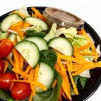Tossed Salad · green salad topped with shredded carrots, grape tomatoes, and sliced cucumbers.
