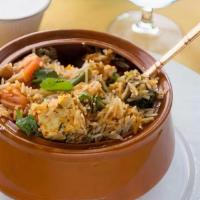Vegetable · Biryani is an aromatic blend of Indian basmati rice with flavored spices and herbs. Served w...