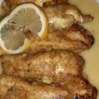 Chicken Piccante · Breast of Chicken, Sautéed with Lemon, White Wine and Butter, Served with Lemon Twist