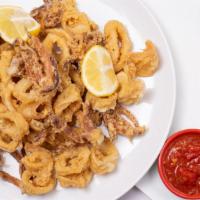 Fried Calamari · Fried squid (calamari) is quickly deep fried, keeping it crunchy on the outside and simply p...