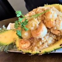 Pineapple Fried Rice · Dice fresh pineapple with shrimp, beef, crab meat or chicken.