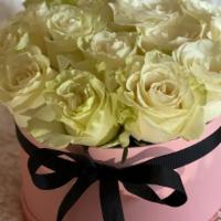 2 Dozen Boxed Roses · 2 dozen roses delicately arranged in a pink or black hat box.