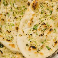 Garlic Naan · Plain naan cooked in tandoor topped with garlic.