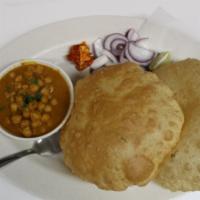 Chole Bhatura (2) · Vegetarian. Deep fried puffed bread (2 pieces) served with spicy chickpeas curry.