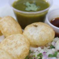 Pani Puri · Vegetarian. Six puffed puris filled with potato, chickpeas, tamarind chutney served with chi...
