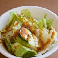 House Salad · Lettuce, carrot, cucumber with ginger dressing.