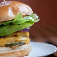 Lulu’S Burger · Double patty, kraft cheese, fancy sauce, bibb, house pickles, onion, and tomato.