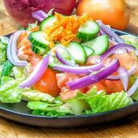 Ani'S House Salad · Lettuce, tomatoes, and cucumbers tossed with olive oil, lemon juice and sumac dressing.