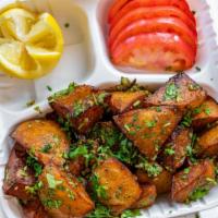 Lemon Potatoes · Vegetarian. Chunks of potato are very lightly fried to perfection and mixed with lemon juice...