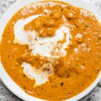 Butter Chicken · Chicken cooked in makhani gravy on the bone. Served with steamed rice and salad.