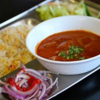 Lamb Curry · Cubes of lamb cooked in thick gravy of exotic spices and herbs. Served with steamed rice and...