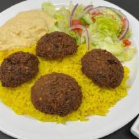 Falafel Lunch · 4 pieces of falafel served with rice, hummus, salad, tahini sauce and pita bread