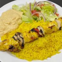 Chicken Kebab Lunch · Chicken Kebab served with Rice, Hummus, Salad & Pita Bread.