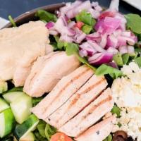 Greek Chicken Salad · baby greens, grilled chicken, cucumber, tomato, feta, red onion, black olives & hummus