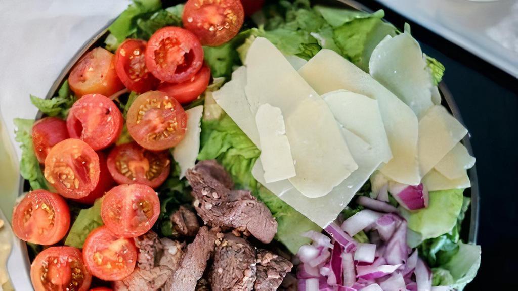 Arugula Steak Salad · baby greens, sirloin steak, red onion, cherry tomato, shaved parmesan cheese & house dressing