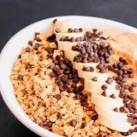 Health Nut Bowl · blended banana, organic chocolate protein, . natural peanut butter smoothie bowl topped with...