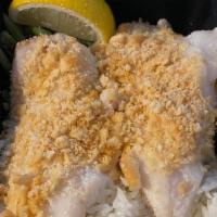 Baked Haddock · Baked haddock fillet lightly coated with an herb cracker crust served with lemon, white wine...