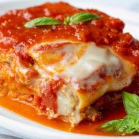 Lasagna Lucia · Nonna Lucia’s recipe, fresh pasta layered with egg, ground veal, Mozzarella &. tomato sauce