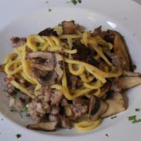 Chitarra Tartufo · Abruzzese Chitarra-cut pasta with wild mushrooms, sausage with white truffle oil