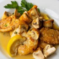 Pollo Lucia · Boneless chicken breast sautéed with artichoke hearts and mushrooms in a light lemon sauce