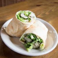 Grape Leaves Roll Up · A vegetarian delight. Served in fresh pita bread with hummus, Parsley, pickles and our tahin...