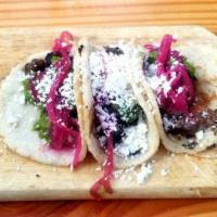Carne Asada Tacos · house made tortillas, prime sirloin, avocado chimichurri, Cotija

-3 per order-