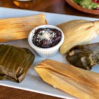 Tamales · Five Wrapped and steamed in banana and corn leaves, an assortment of 5 corn dough mini tamal...