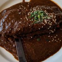 Mole Suave · Chicken breast and longaniza served in a homemade red mole sauce
