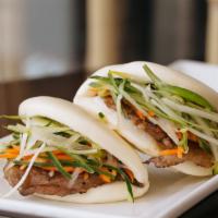 Le Viet Sliders · Steamed bun with carrots, scallion, cucumber and hoisin sauce with your choice of grilled be...