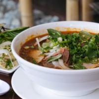 Spicy Beef & Pork Noodle Soup · (Bun Bo Hue ) Beef shank, flank, pork roll and pig feet soup served with thick vermicelli no...