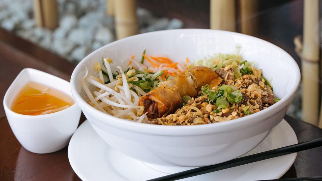 Grilled Pork Vermicelli  · (Bun Thit Nuong Cha Gio)Grilled marinated pork served with bean sprouts, chopped vegetables, peanuts and fried spring roll.