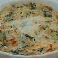 Spinach & Artichoke Dip · A creamy blend of spinach, artichoke hearts, and Parmesan cheese served with tortilla chips.