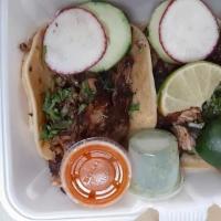 Tacos De Surtida · Tripa, carnitas, and lengua.