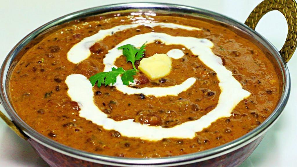Dal Makhani · Simmered black lentils and red kidney beans cooked with tomatoes, ginger, onions and fresh garlic.