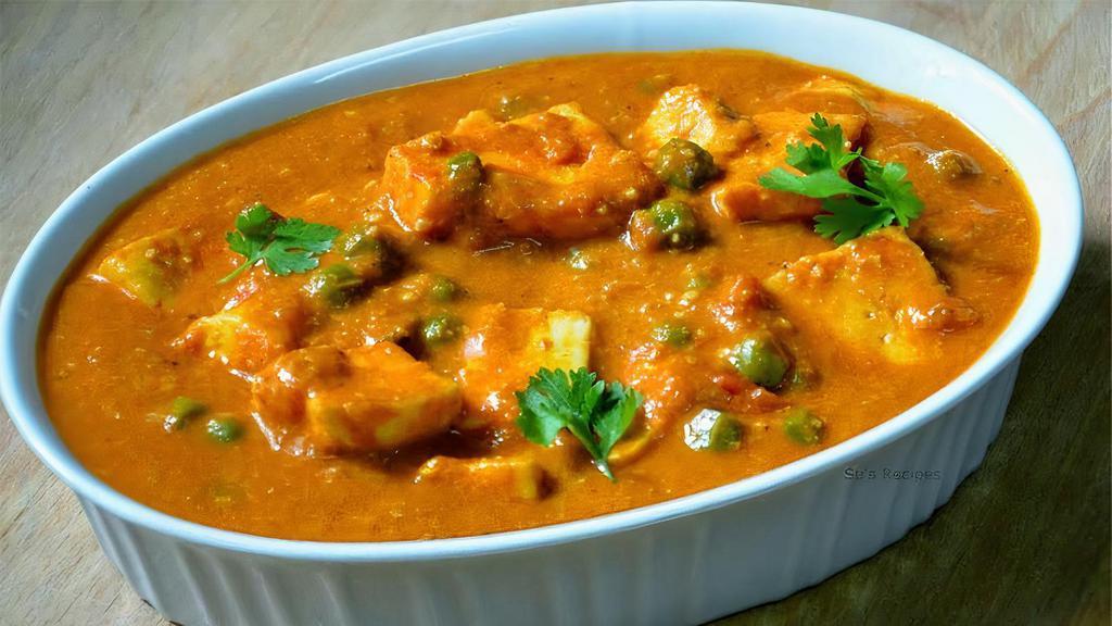 Paneer Butter Masala · Home-made cheese cubes, onions and tomatoes cooked in our special sauce.