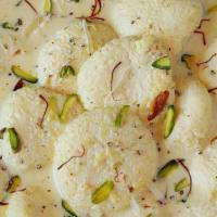 Rasmalai (2 Pieces) · Sweet spongy cottage cheese patties in reduced cardamom flavored milk, garnished with pistac...